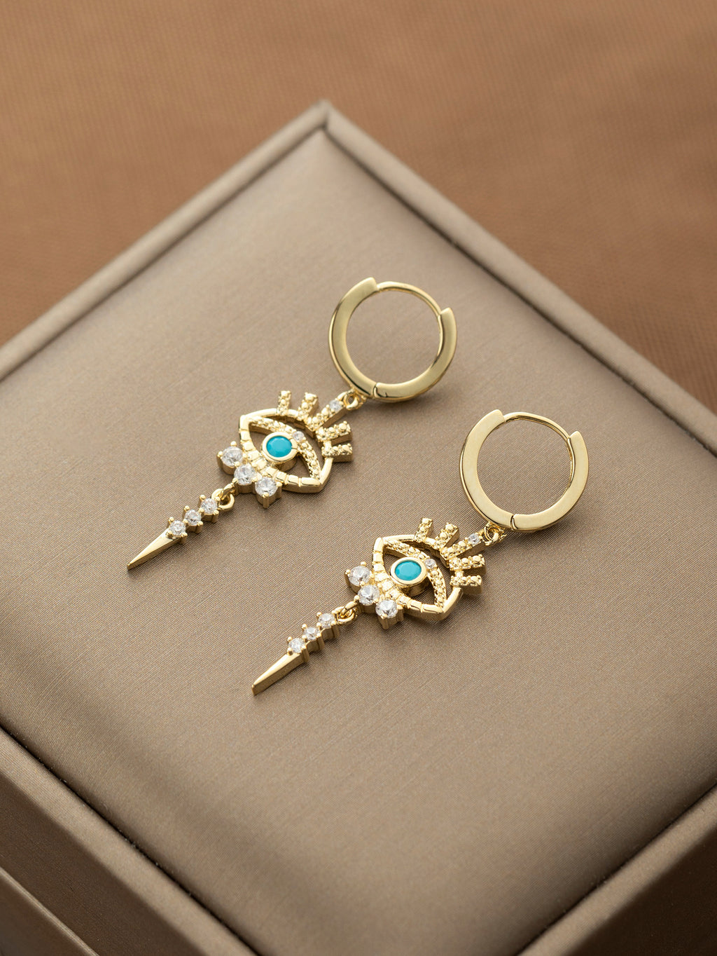 boucles d'oreilles pendantes motifs oeil