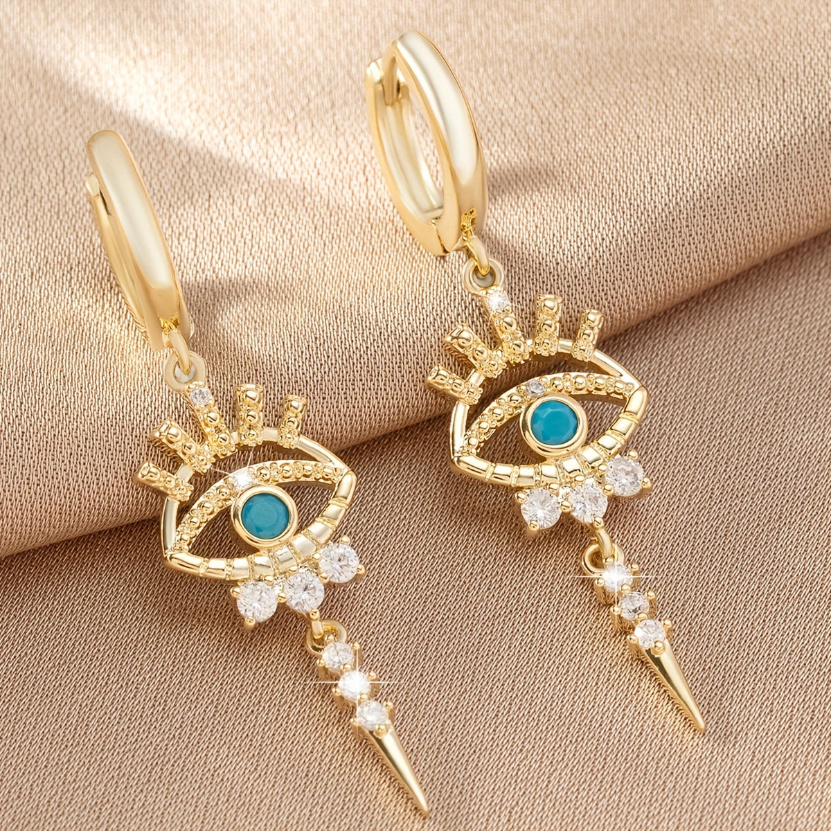 boucles d'oreilles pendantes motifs oeil