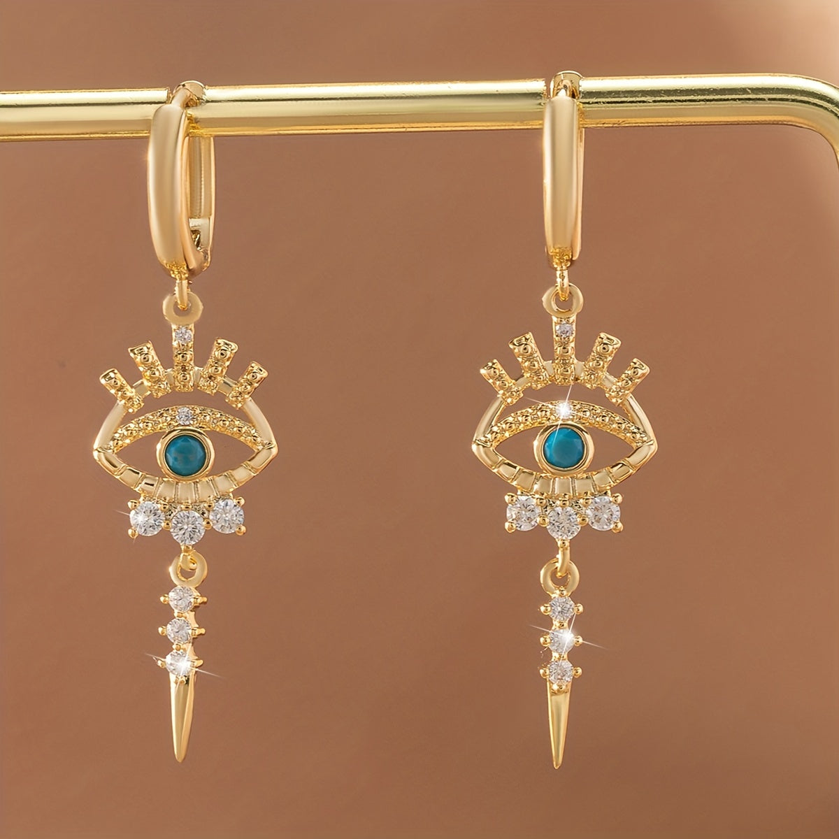 boucles d'oreilles pendantes motifs oeil