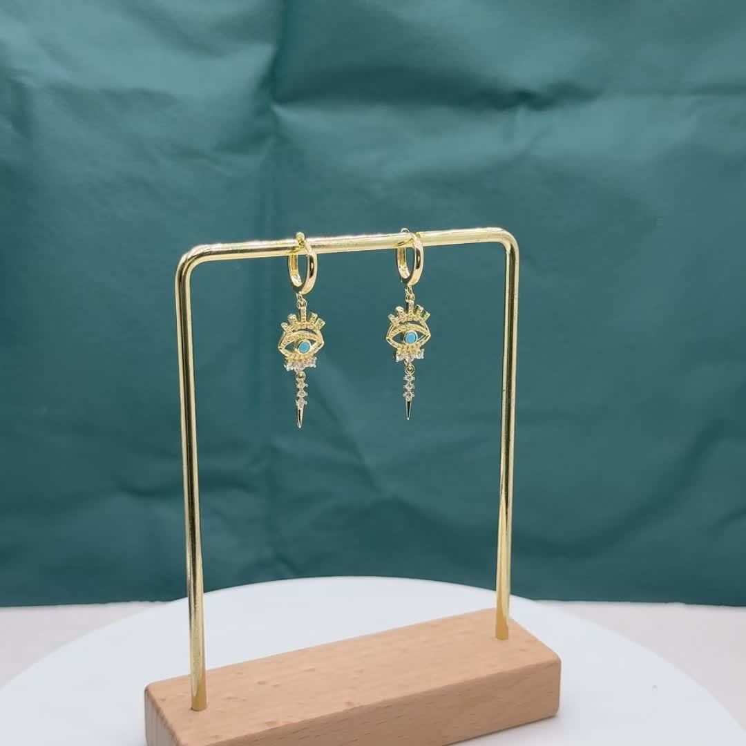 boucles d'oreilles pendantes motifs oeil