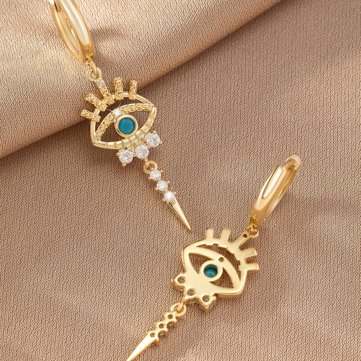 boucles d'oreilles pendantes motifs oeil