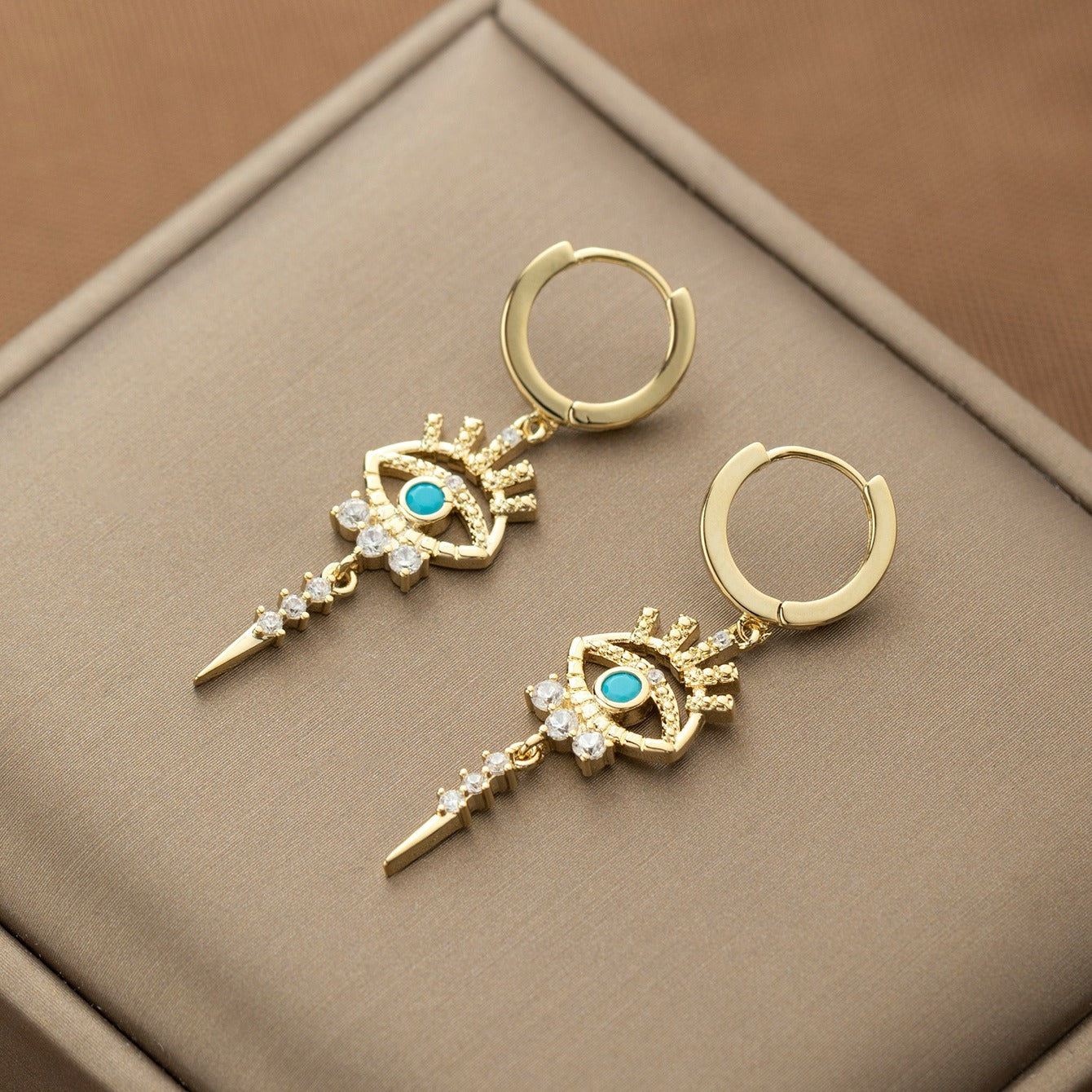 boucles d'oreilles pendantes motifs oeil